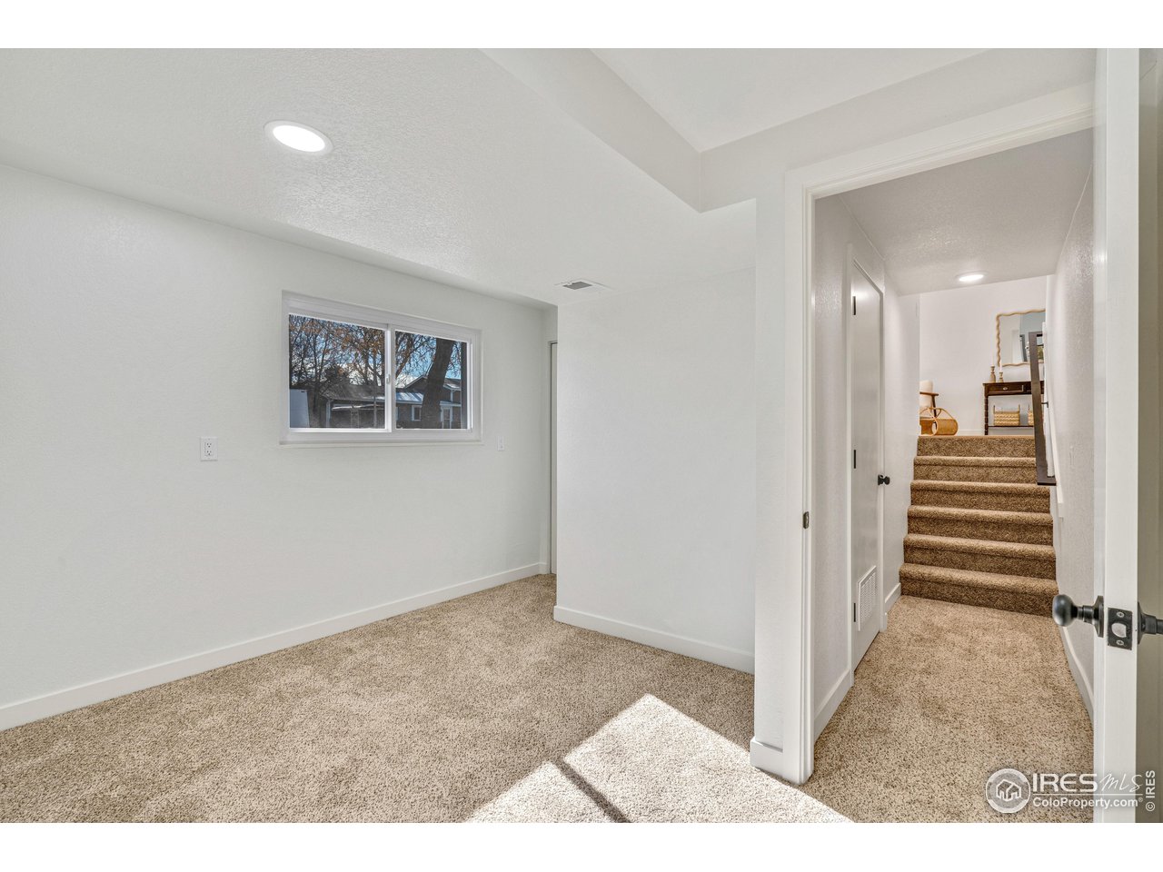 1115 2nd Street Road Eaton, CO 80615 - Photo 29 of 39 a view of a hallway with wooden floor and staircase