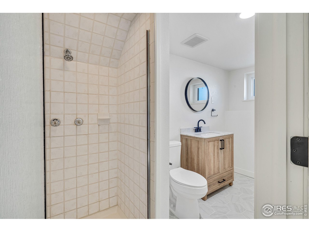 1115 2nd Street Road Eaton, CO 80615 - Photo 30 of 39 a bathroom with a sink mirror and vanity