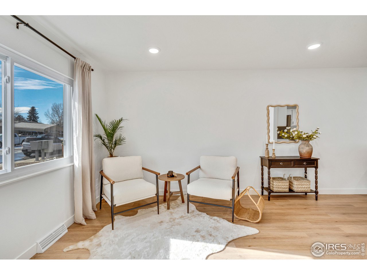 1115 2nd Street Road Eaton, CO 80615 - Photo 3 of 39 a living room with furniture and a wooden floor