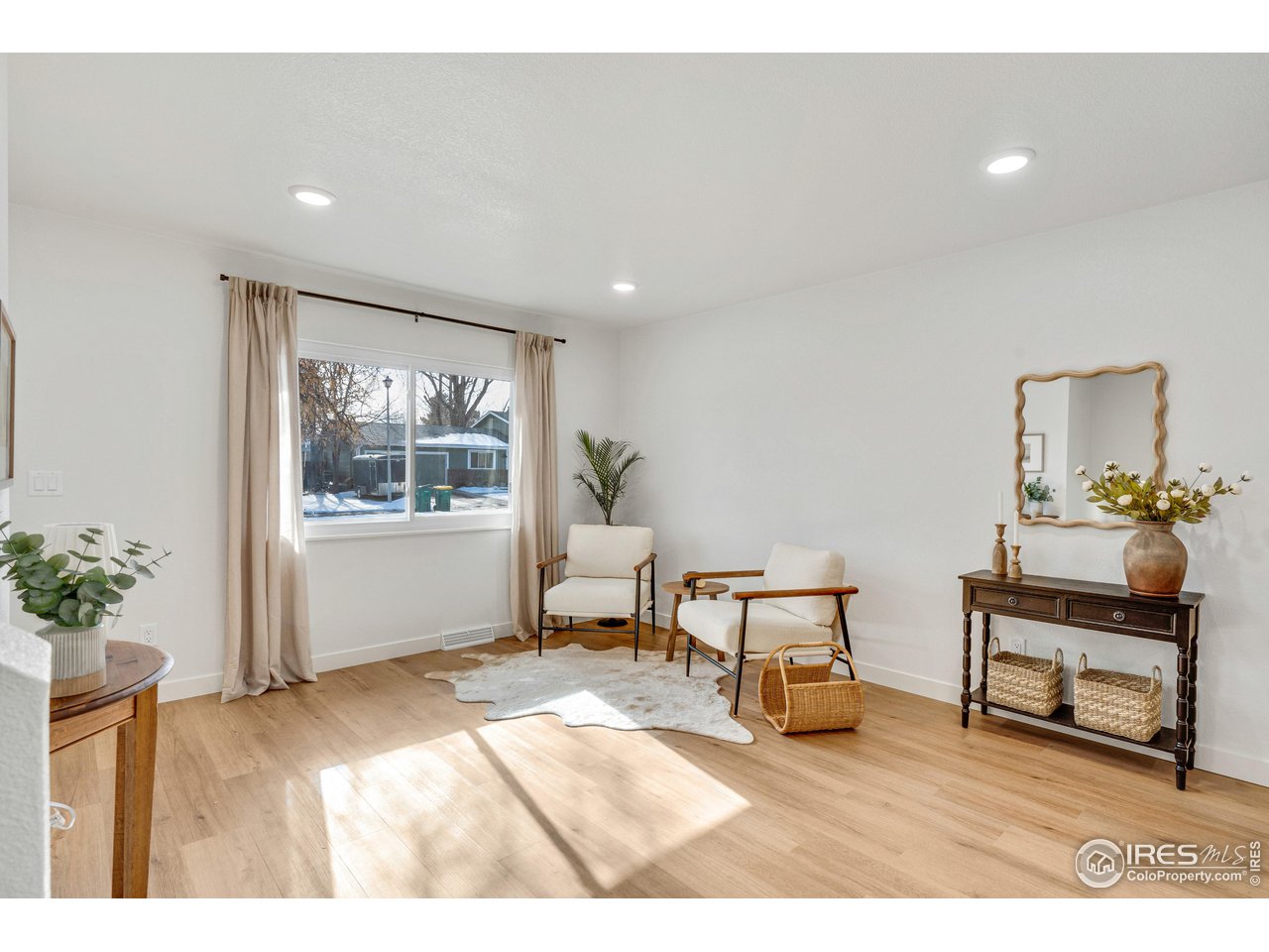 1115 2nd Street Road Eaton, CO 80615 - Photo 4 of 39 a living room with furniture and a potted plant