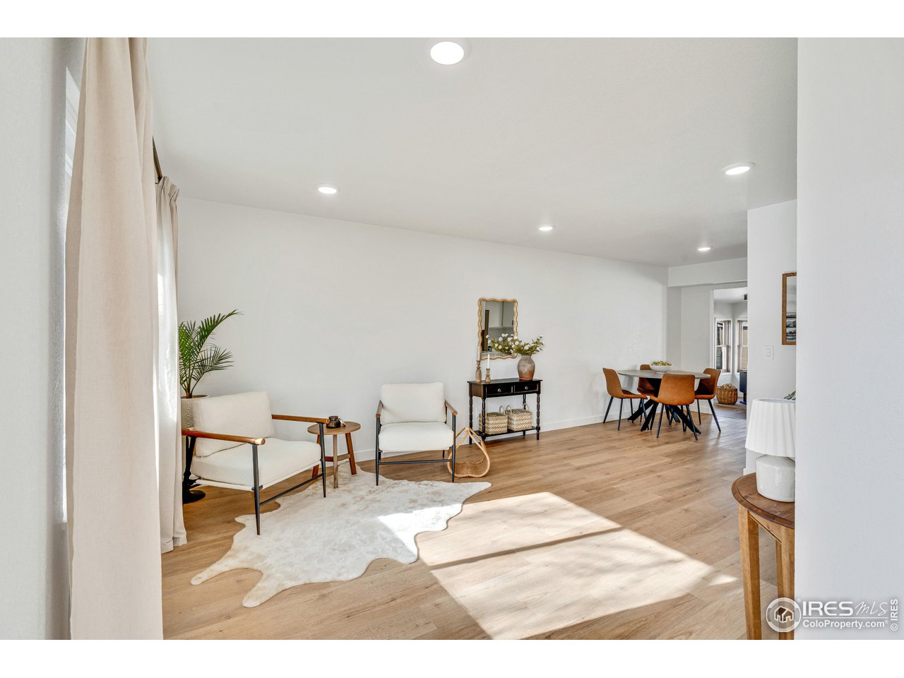 1115 2nd Street Road Eaton, CO 80615 - Photo 5 of 39 a living room with lots of furniture and a dining table with wooden floor