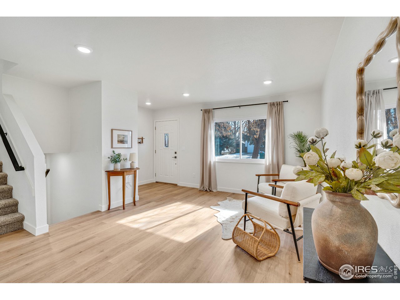 1115 2nd Street Road Eaton, CO 80615 - Photo 6 of 39 a living room with furniture and a wooden floor