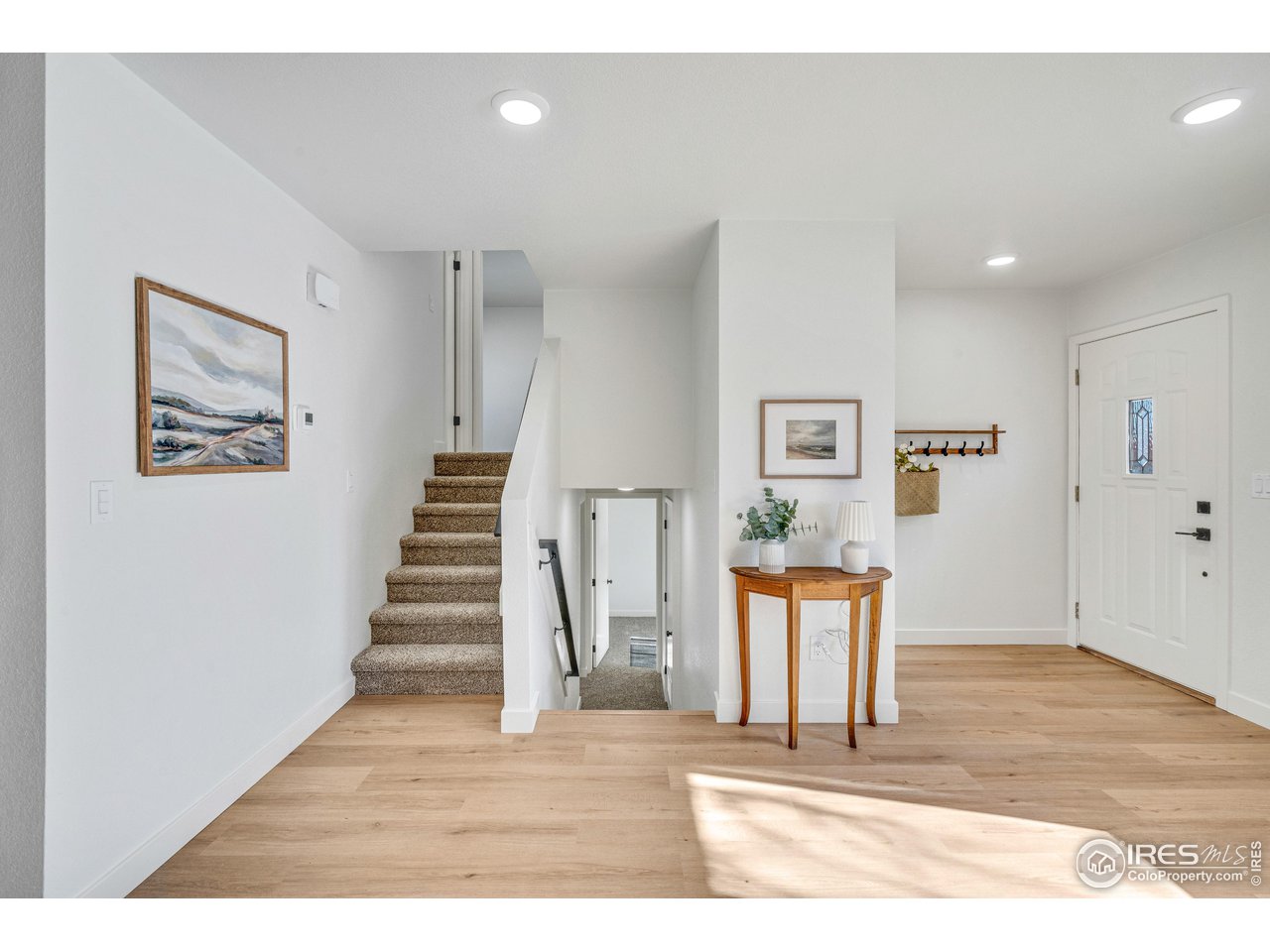 1115 2nd Street Road Eaton, CO 80615 - Photo 9 of 39 a view interior of a house with wooden floor and stairs