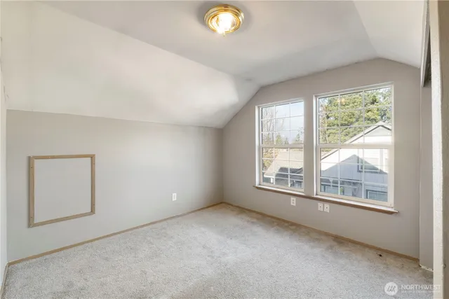 an empty room with windows and yard