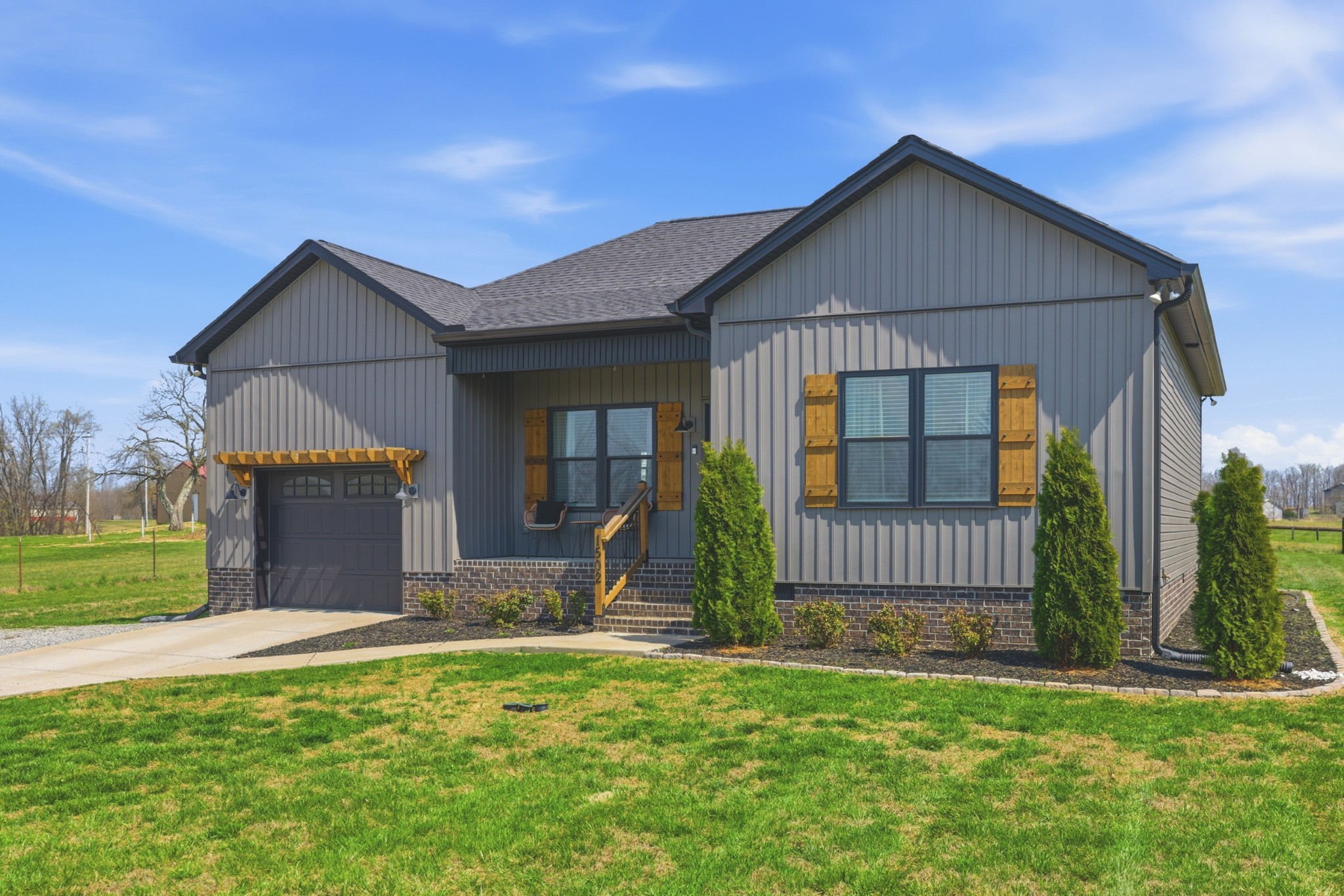 1502 Rock Bridge Road Bethpage, TN 37022 - Photo 2 of 40 a front view of a house with a garden