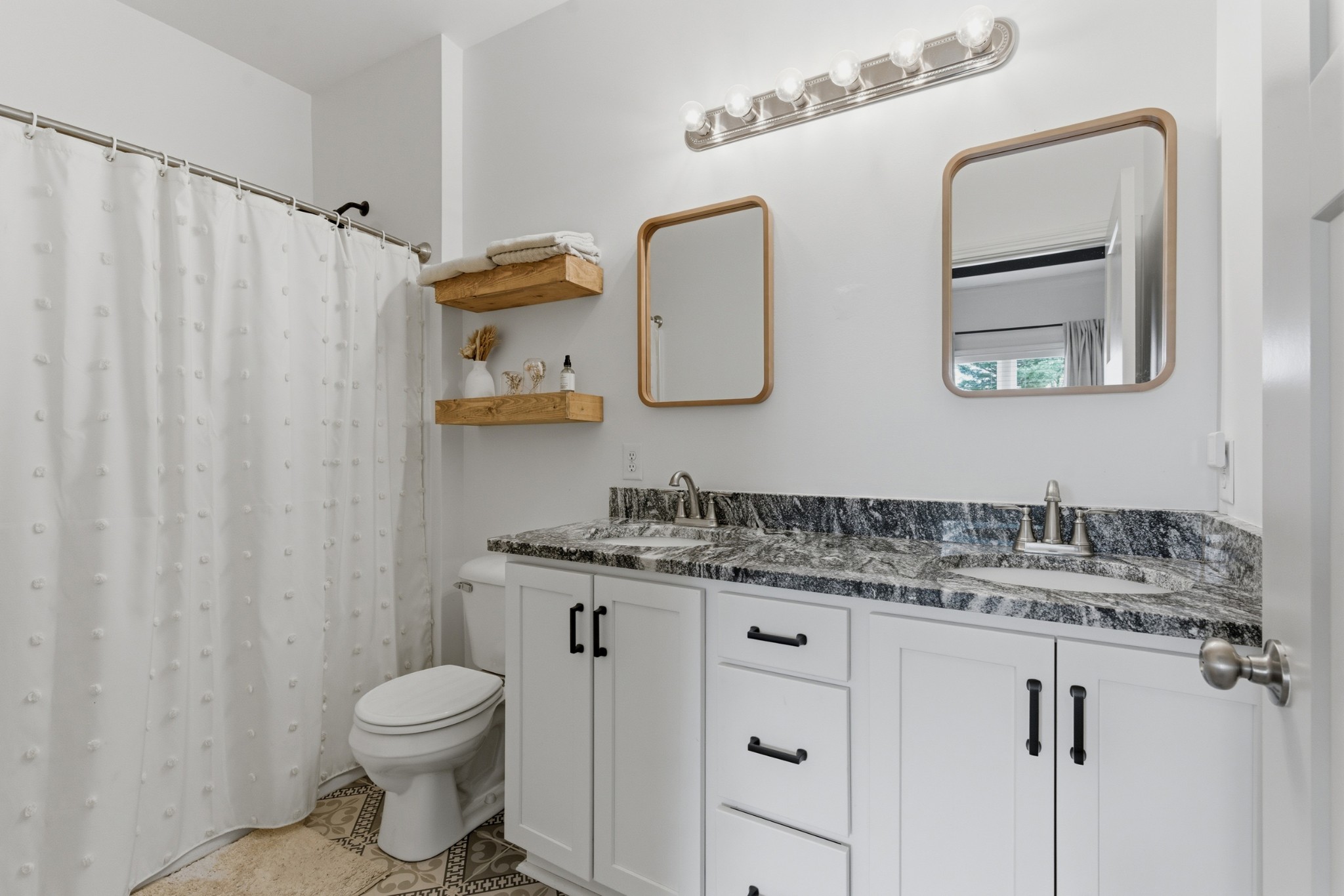 1502 Rock Bridge Road Bethpage, TN 37022 - Photo 21 of 40 a bathroom with a granite countertop sink vanity mirror and toilet