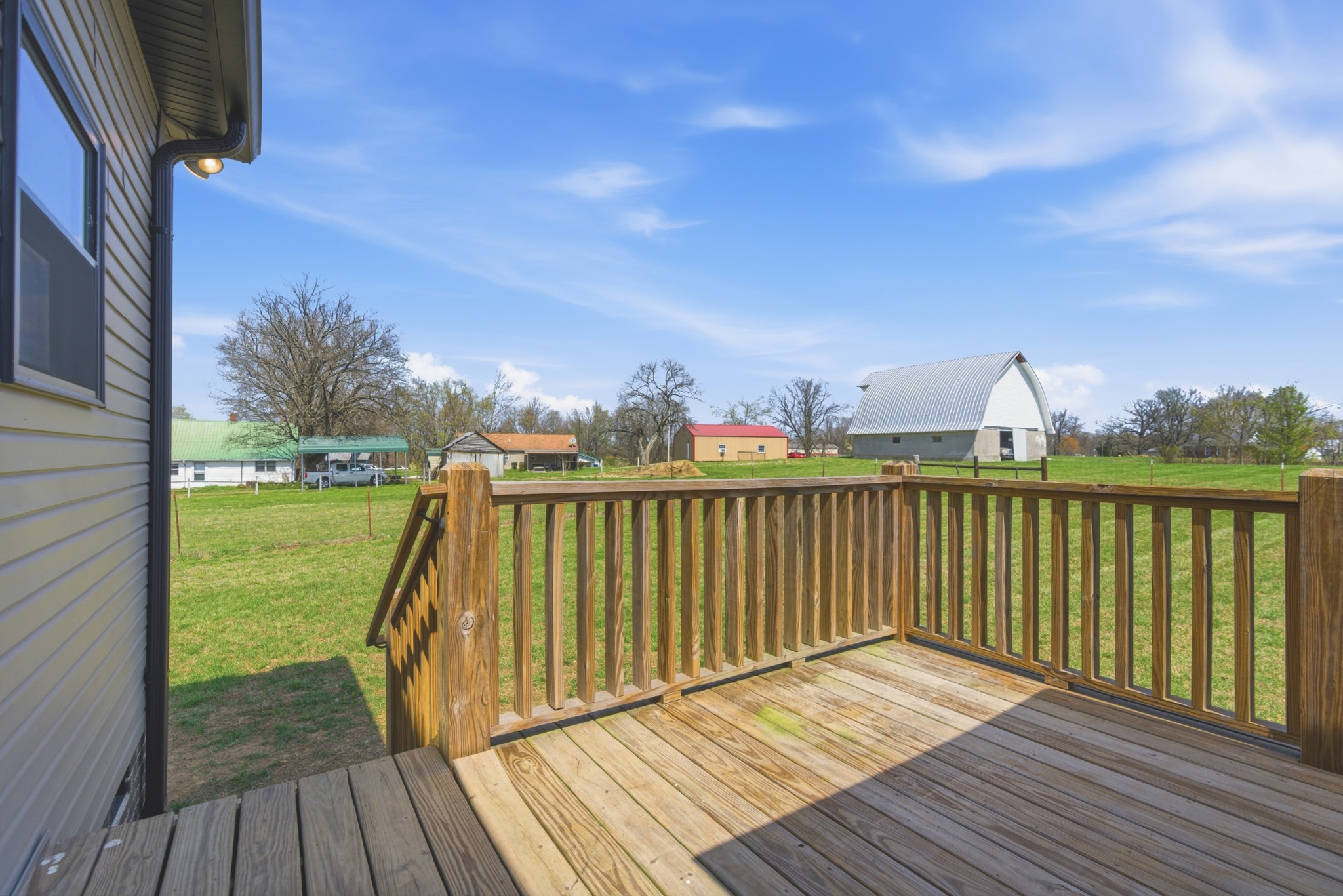 1502 Rock Bridge Road Bethpage, TN 37022 - Photo 26 of 40 a view of a balcony with wooden floor and fence