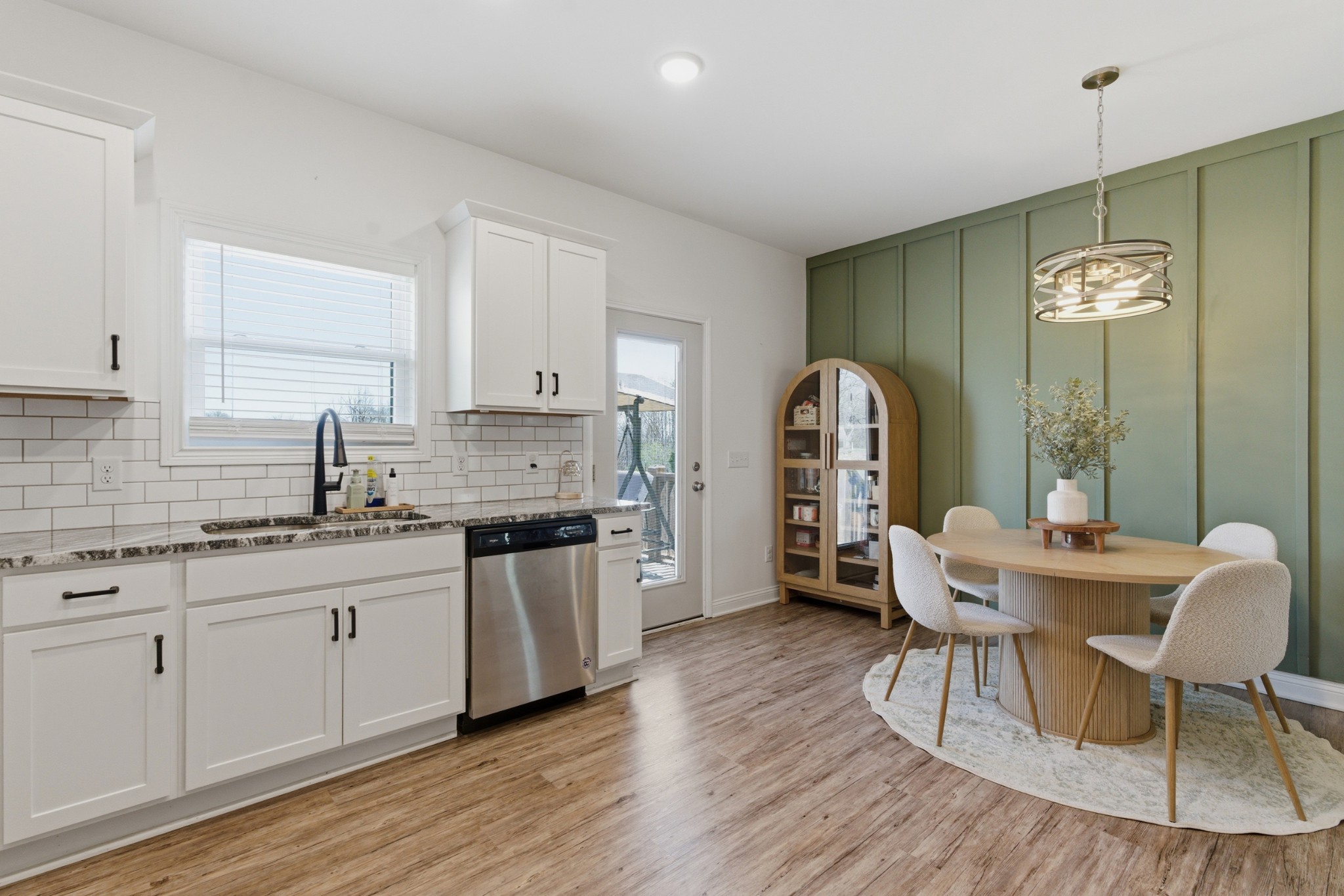 1502 Rock Bridge Road Bethpage, TN 37022 - Photo 10 of 40 a kitchen with a table chairs sink and cabinets