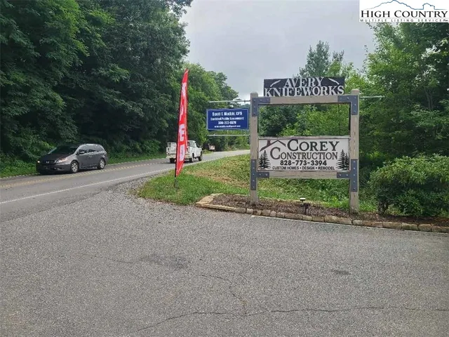a view of street with parked cars