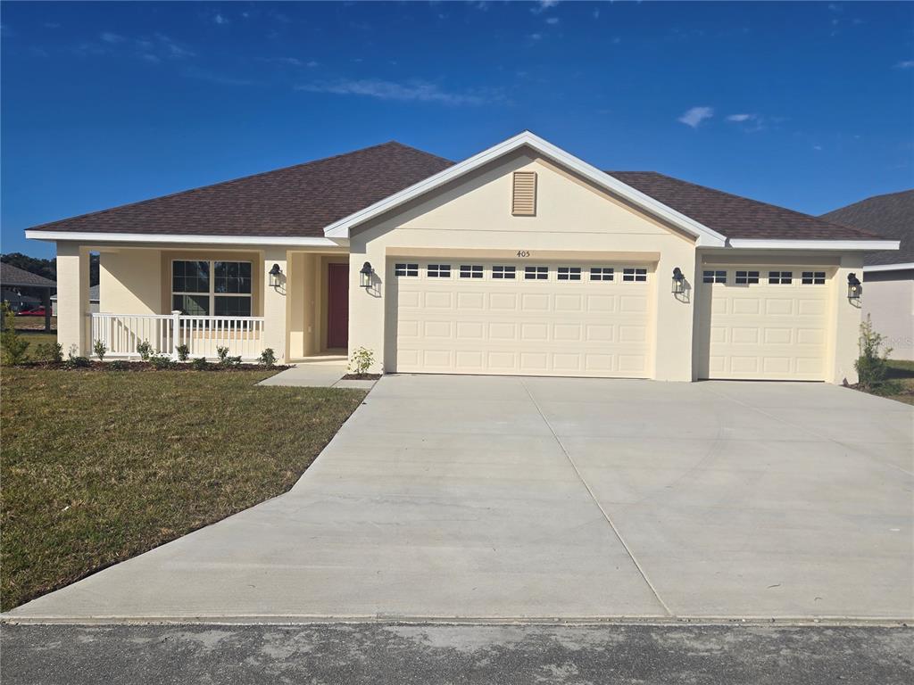 405 Wood Stork Trail Inverness, FL 34453 - Photo 1 of 1 a front view of a house with a yard