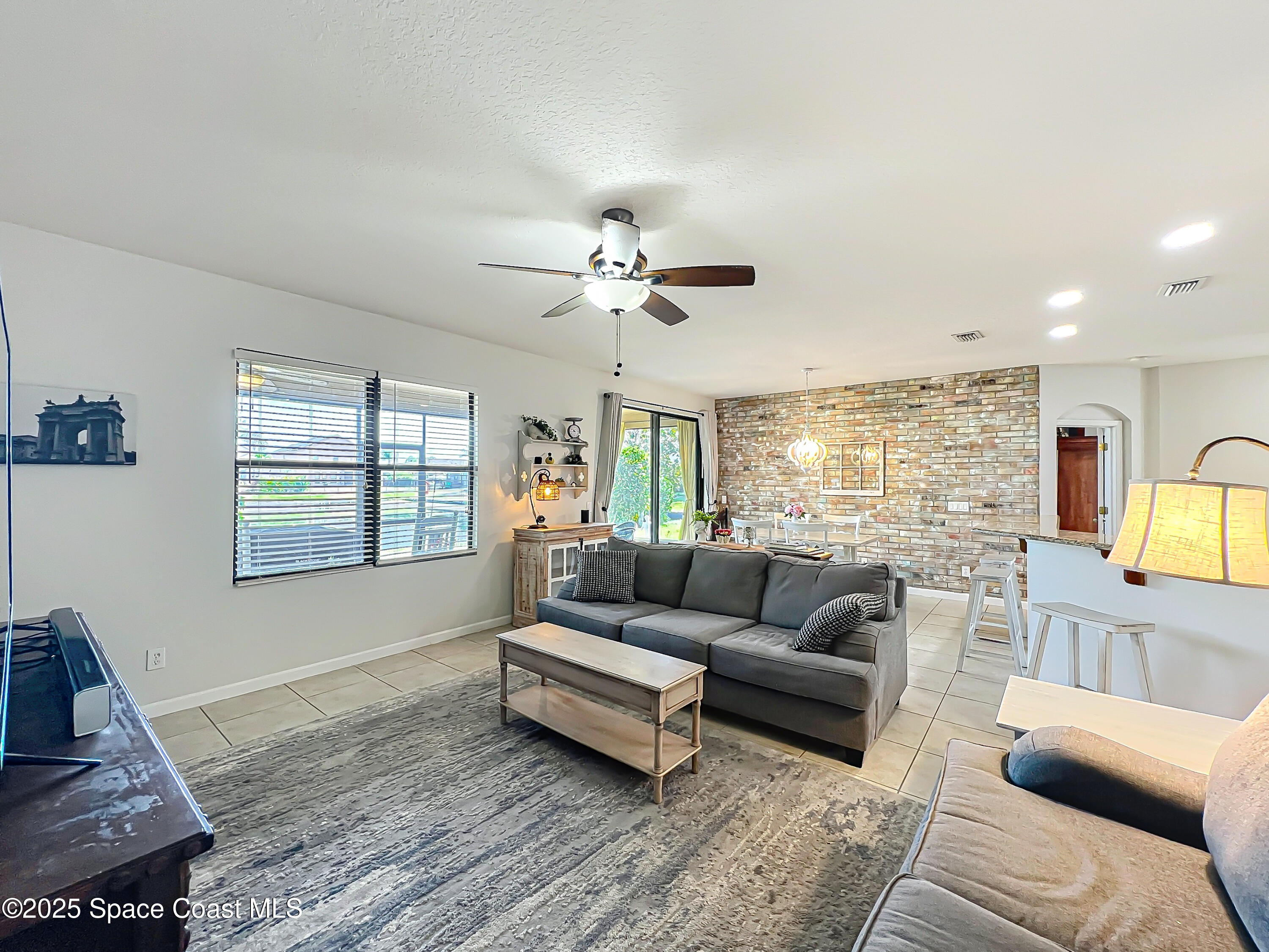 1110 Bolle Circle Rockledge, FL 32955 - Photo 16 of 39 a living room with furniture and a large window