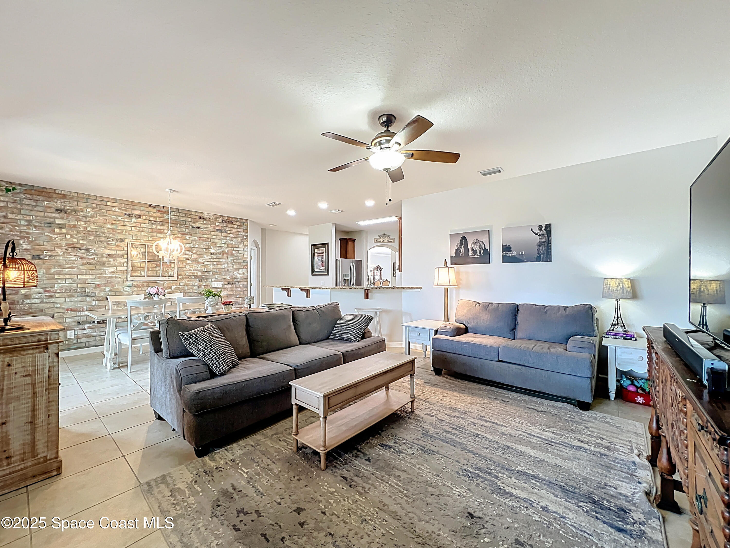 1110 Bolle Circle Rockledge, FL 32955 - Photo 17 of 39 a living room with furniture and a large window