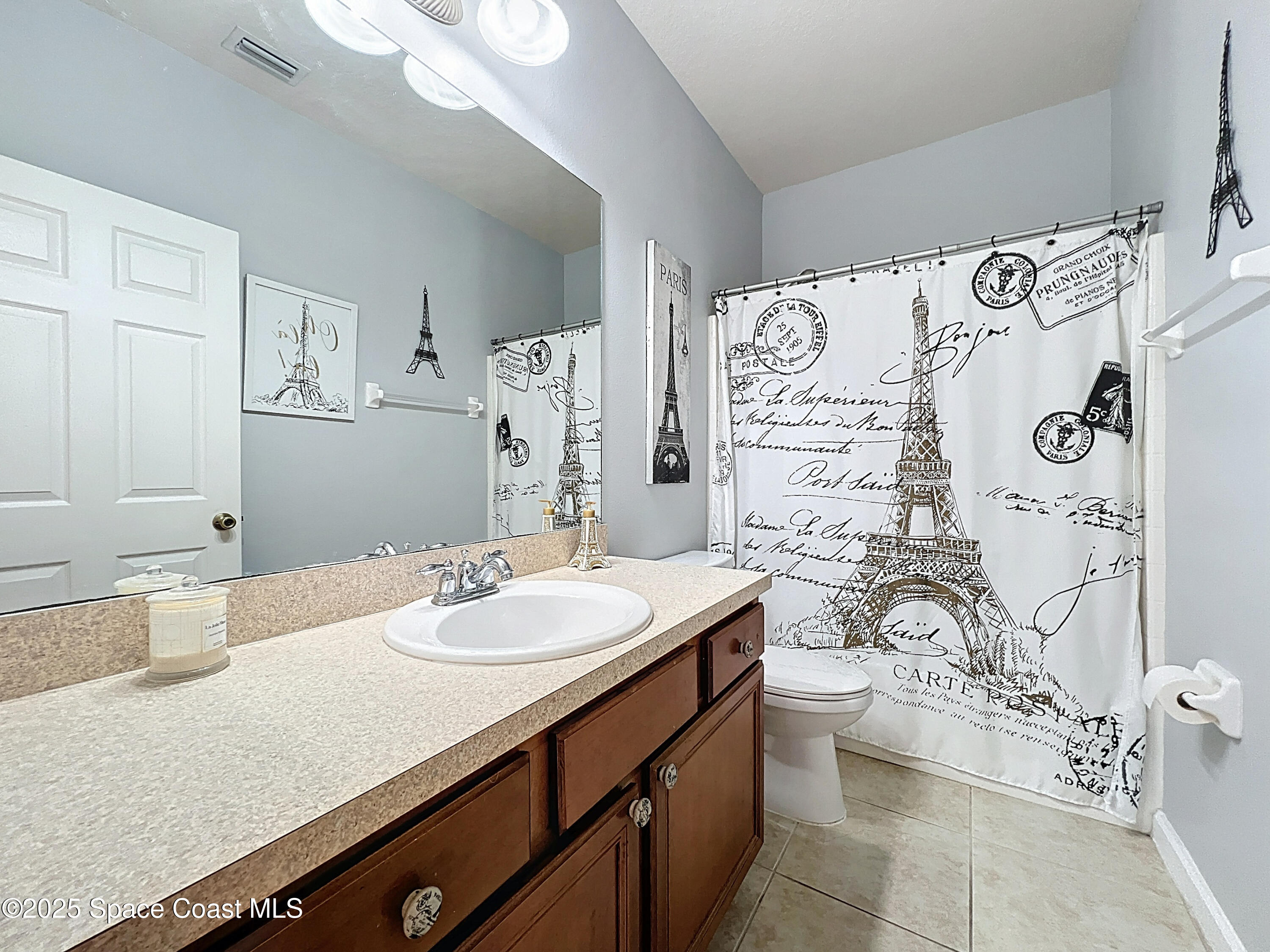 1110 Bolle Circle Rockledge, FL 32955 - Photo 19 of 39 a bathroom with a sink a toilet and shower