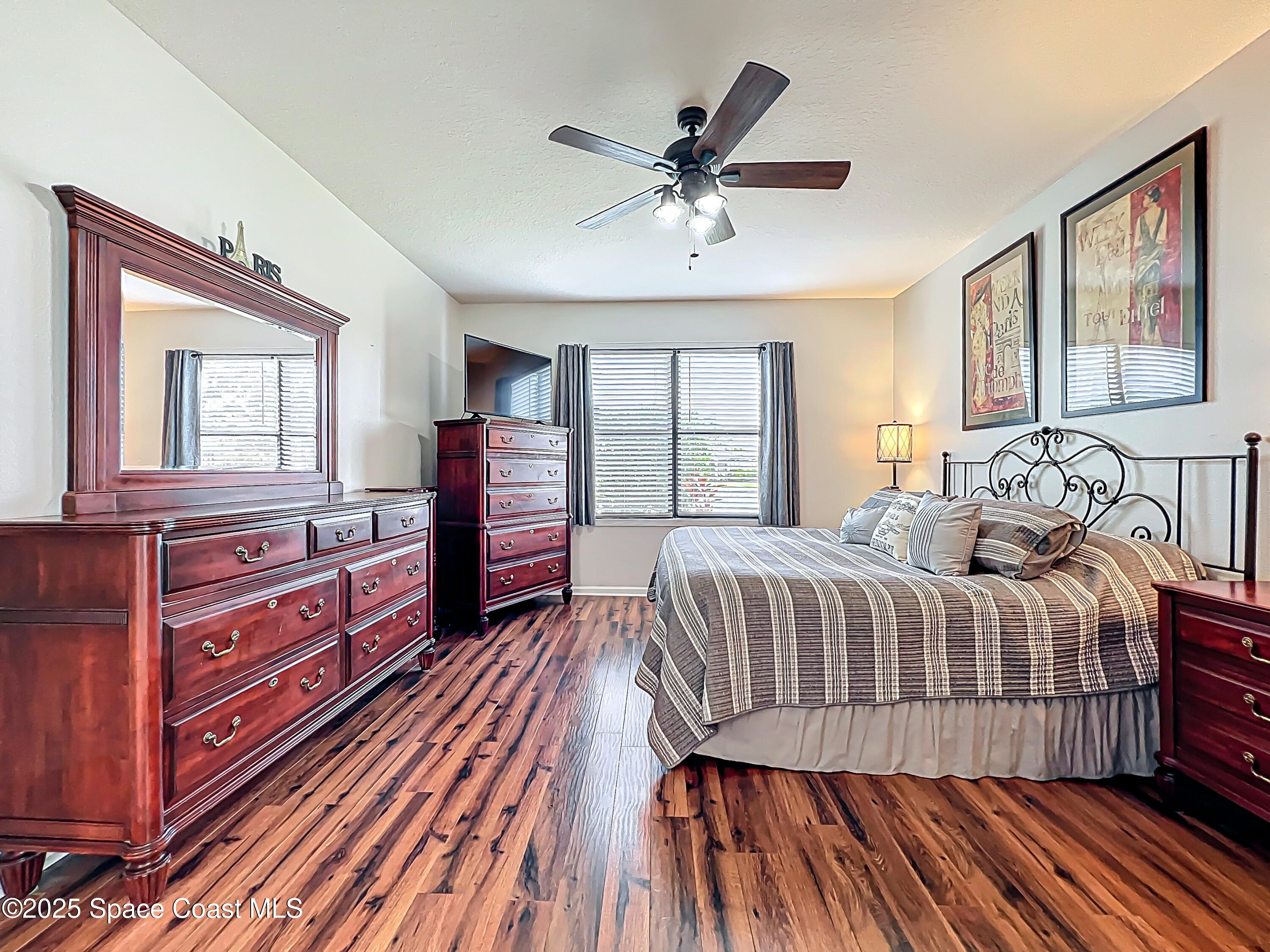 1110 Bolle Circle Rockledge, FL 32955 - Photo 23 of 39 a bedroom with a bed and wooden floor