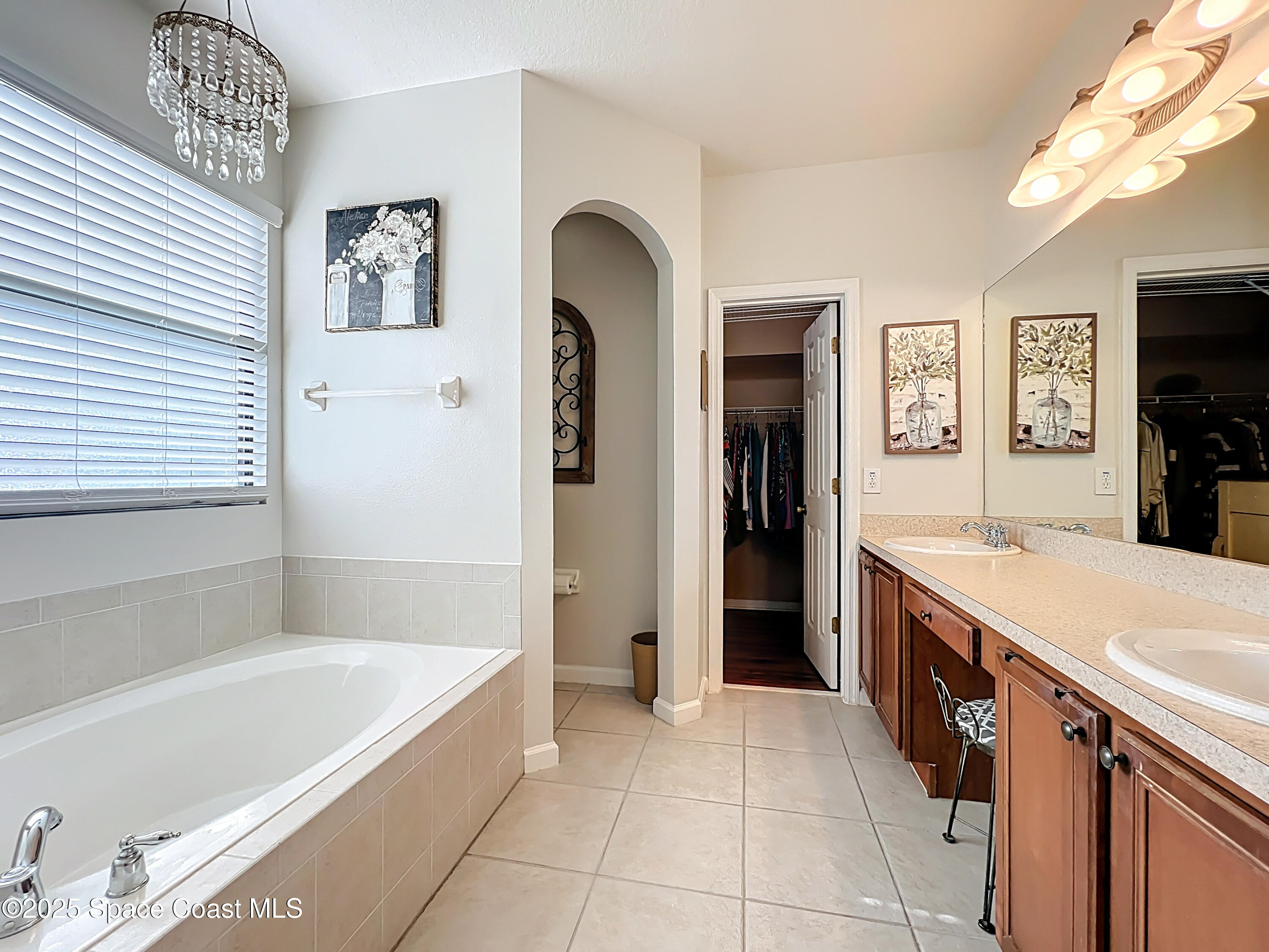 1110 Bolle Circle Rockledge, FL 32955 - Photo 26 of 39 a large spacious bathroom with a tub a sink and a mirror