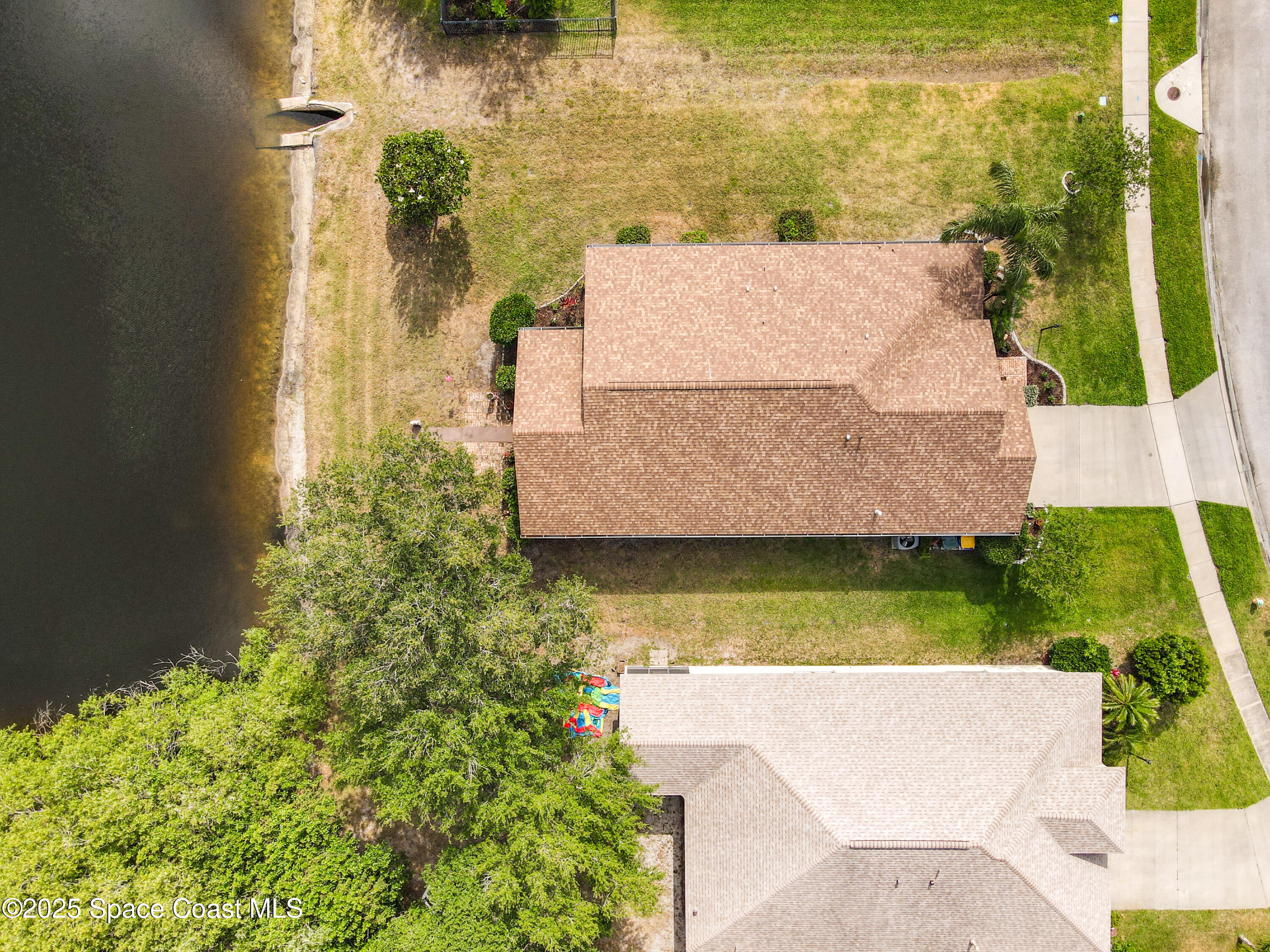 1110 Bolle Circle Rockledge, FL 32955 - Photo 37 of 39 an aerial view of a house with a yard basket ball court