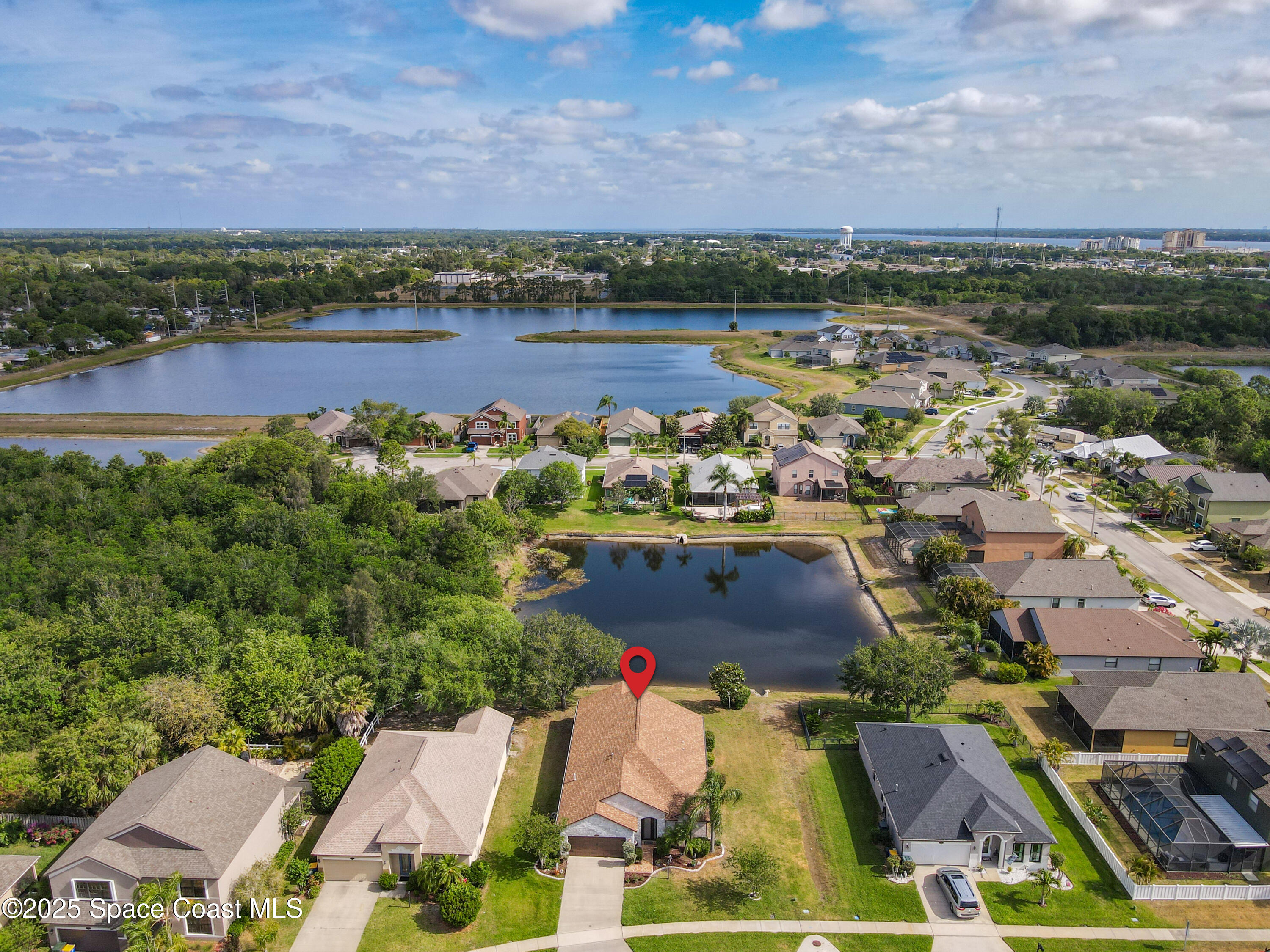 1110 Bolle Circle Rockledge, FL 32955 - Photo 38 of 39 an aerial view of residential houses with outdoor space and lake view