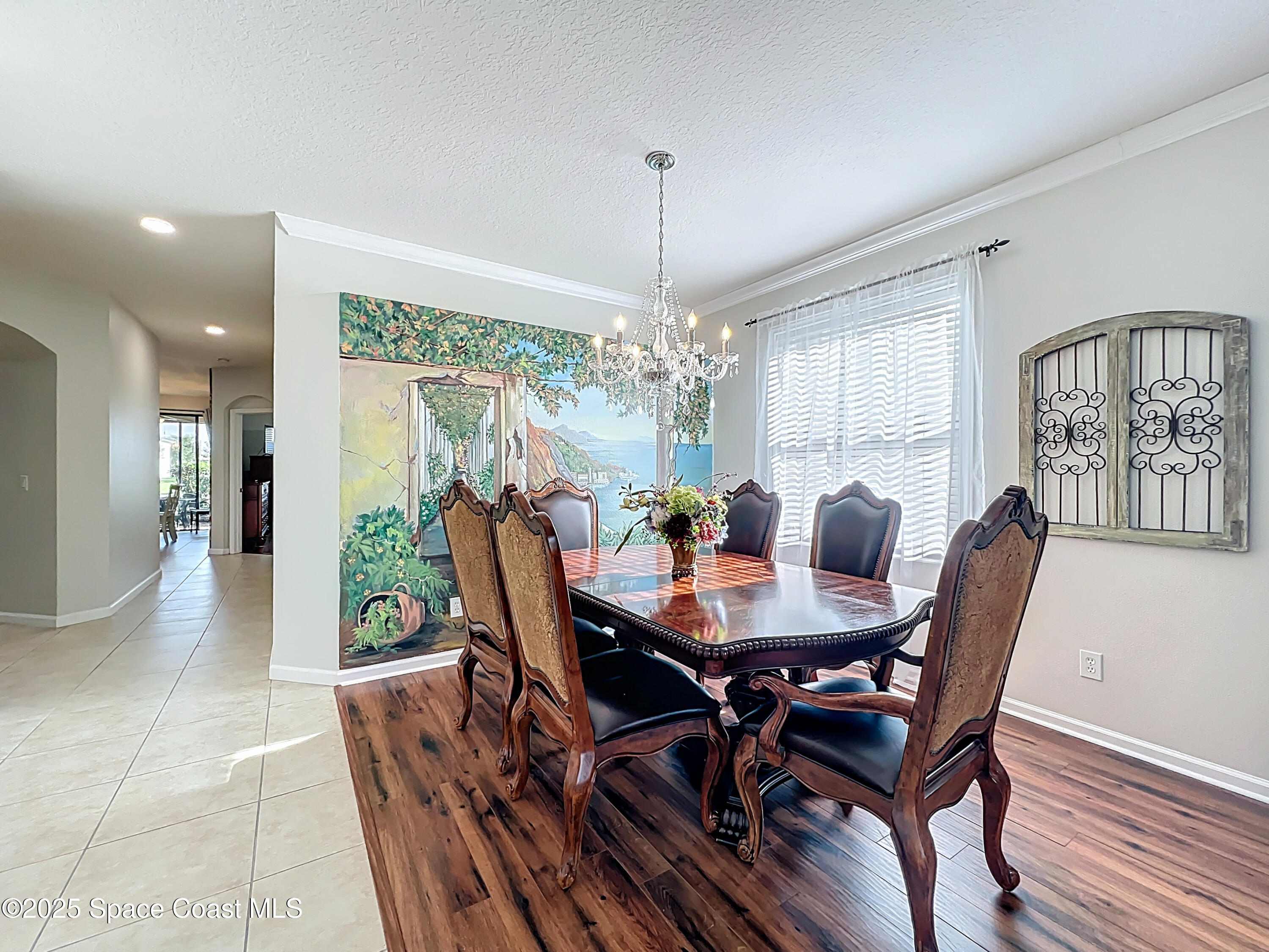 1110 Bolle Circle Rockledge, FL 32955 - Photo 5 of 39 a view of a dining room with furniture window and wooden floor