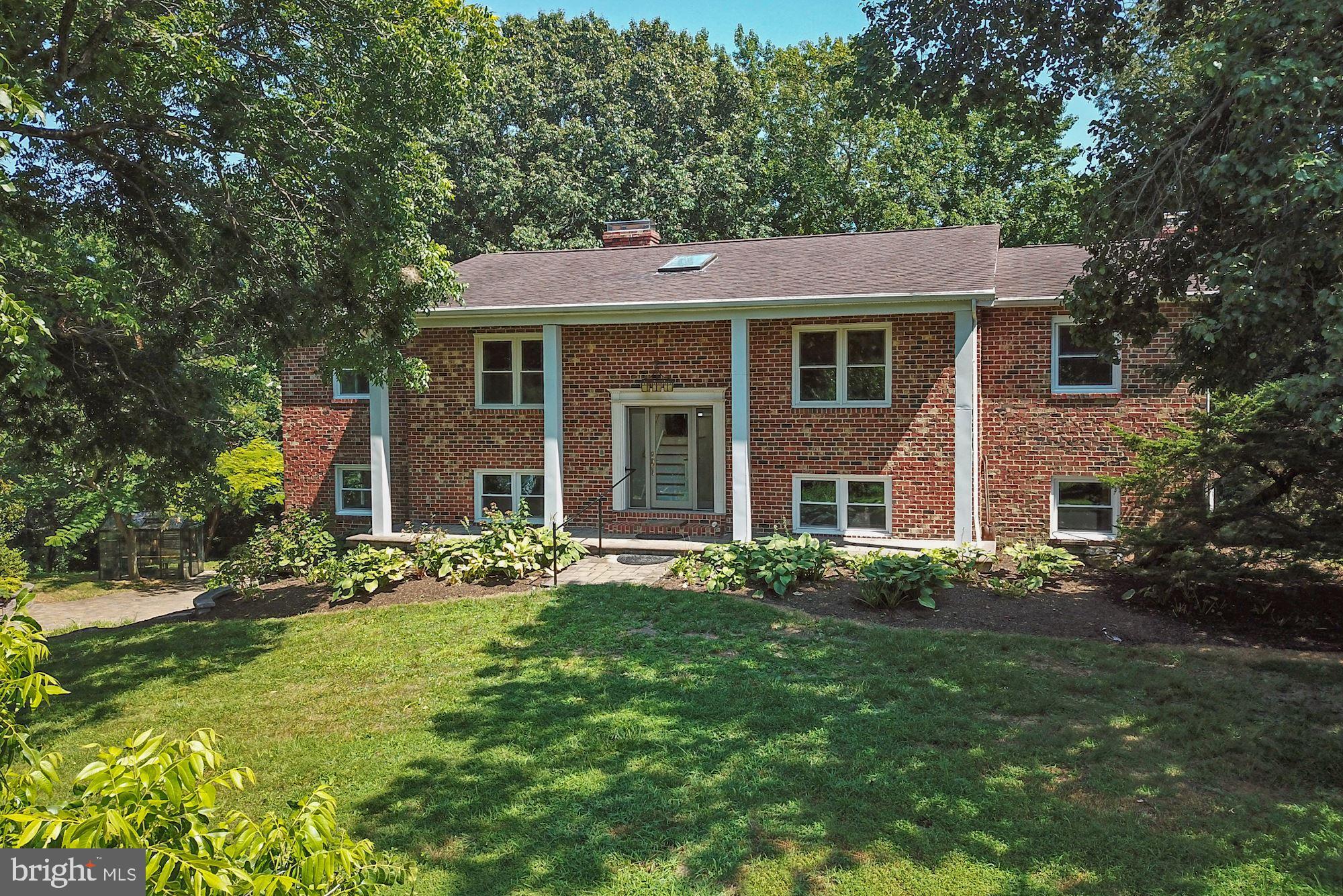 471 Fairhaven Road Tracys Landing, MD 20779 - Photo 2 of 40 a front view of a house with a garden