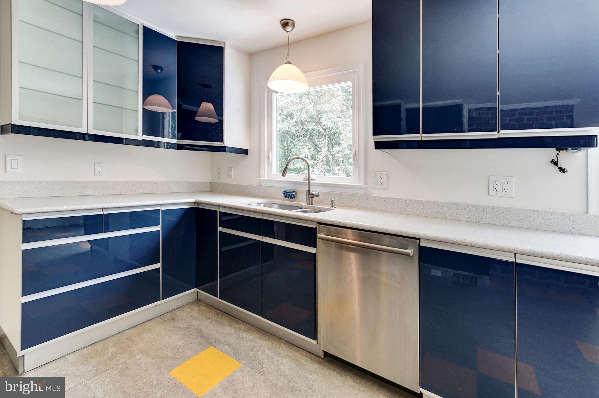 471 Fairhaven Road Tracys Landing, MD 20779 - Photo 11 of 40 a kitchen with a sink and cabinets