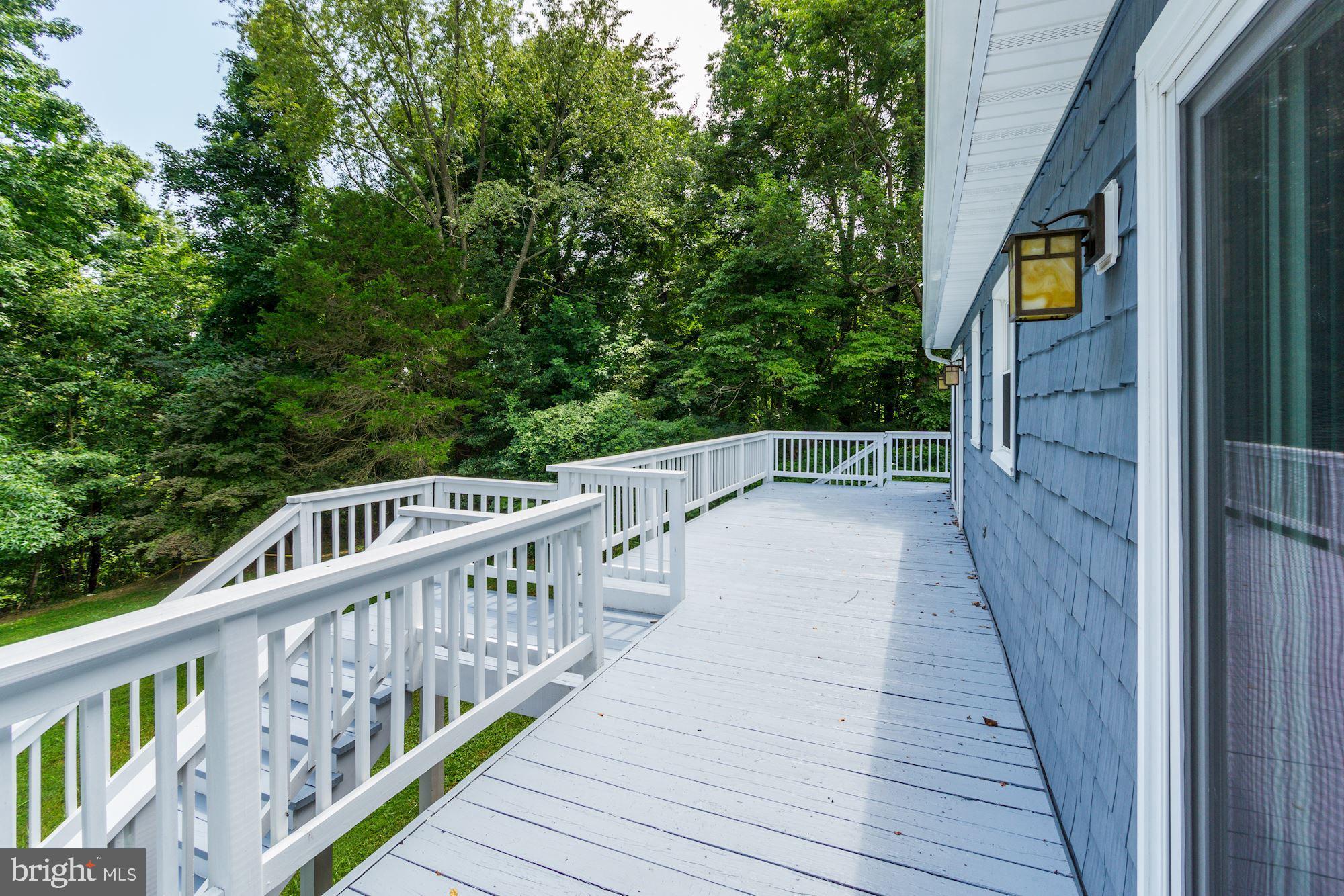 471 Fairhaven Road Tracys Landing, MD 20779 - Photo 13 of 40 a view of balcony with wooden floor and fence