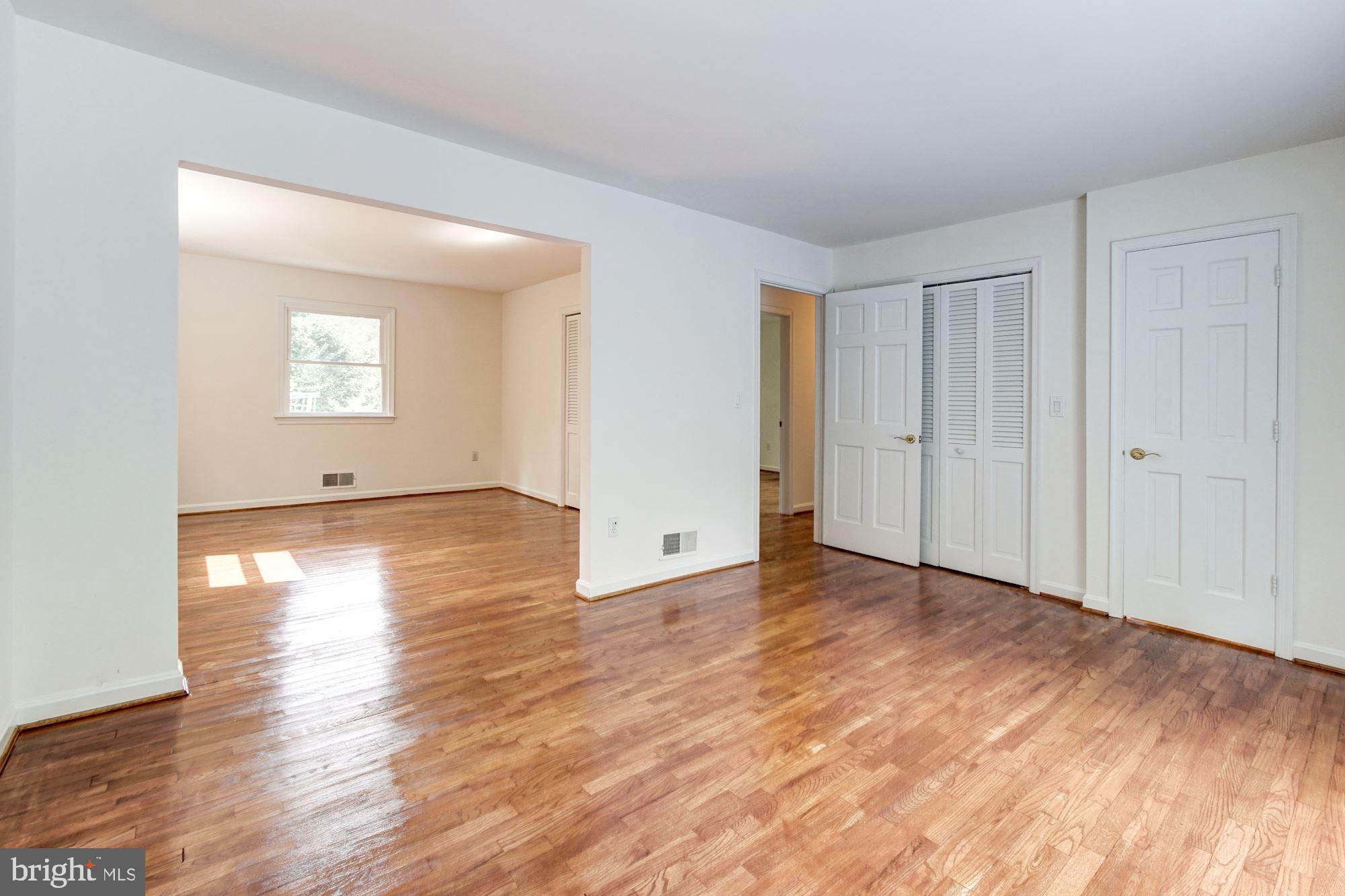 471 Fairhaven Road Tracys Landing, MD 20779 - Photo 17 of 40 a view of an empty room with wooden floor and a window