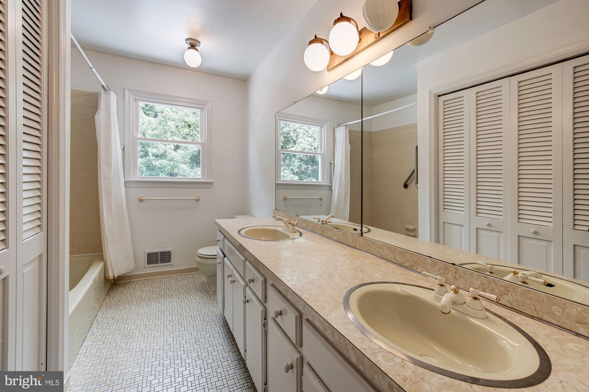 471 Fairhaven Road Tracys Landing, MD 20779 - Photo 19 of 40 a bathroom with a granite countertop double vanity sink a mirror and a shower