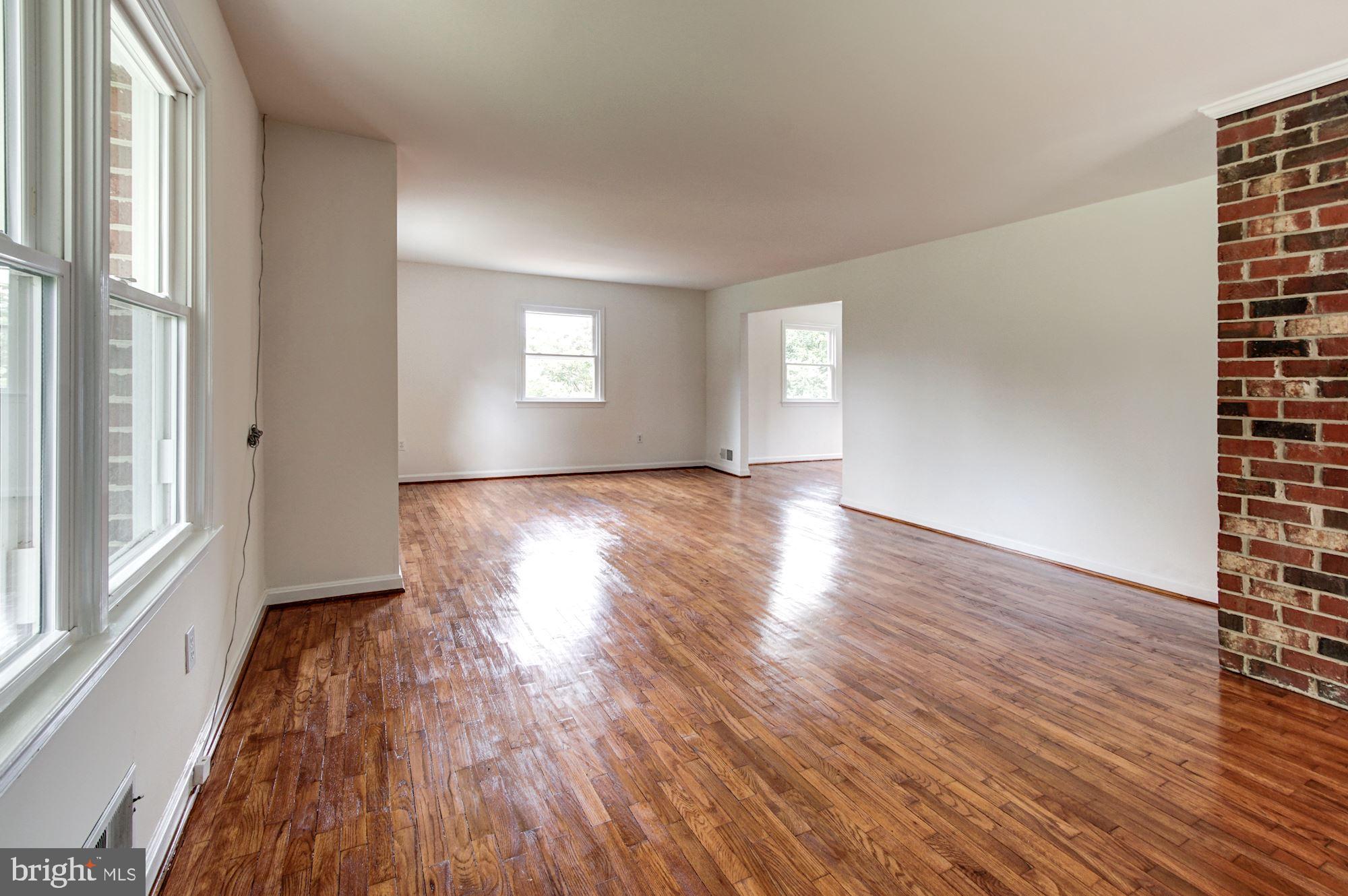 471 Fairhaven Road Tracys Landing, MD 20779 - Photo 3 of 40 a view of an empty room with wooden floor and a window