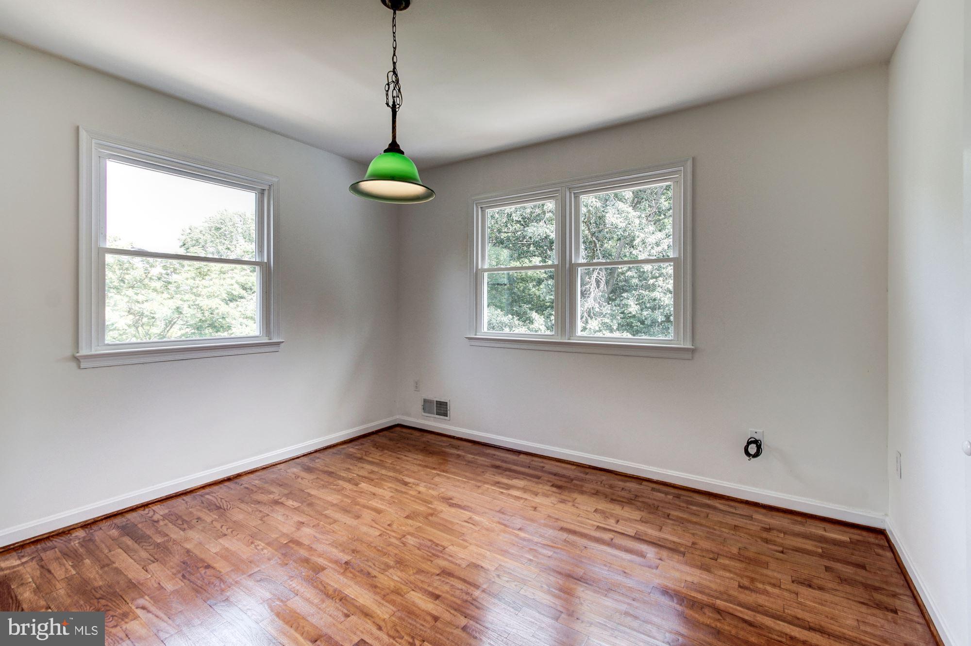 471 Fairhaven Road Tracys Landing, MD 20779 - Photo 6 of 40 a view of an empty room with wooden floor and a window