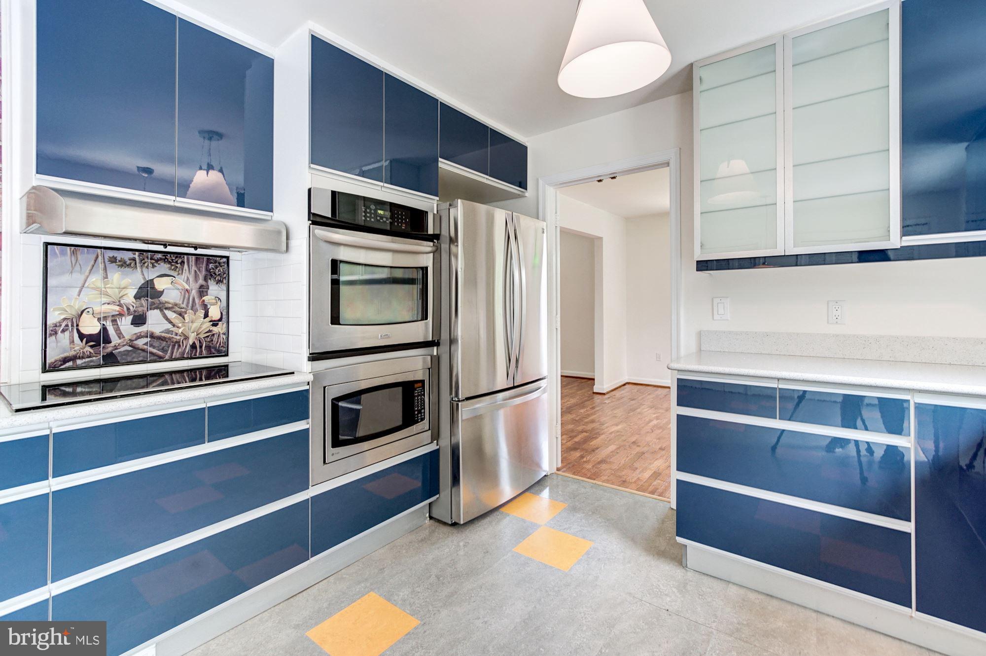 471 Fairhaven Road Tracys Landing, MD 20779 - Photo 9 of 40 a kitchen with stainless steel appliances cabinets and a counter top space