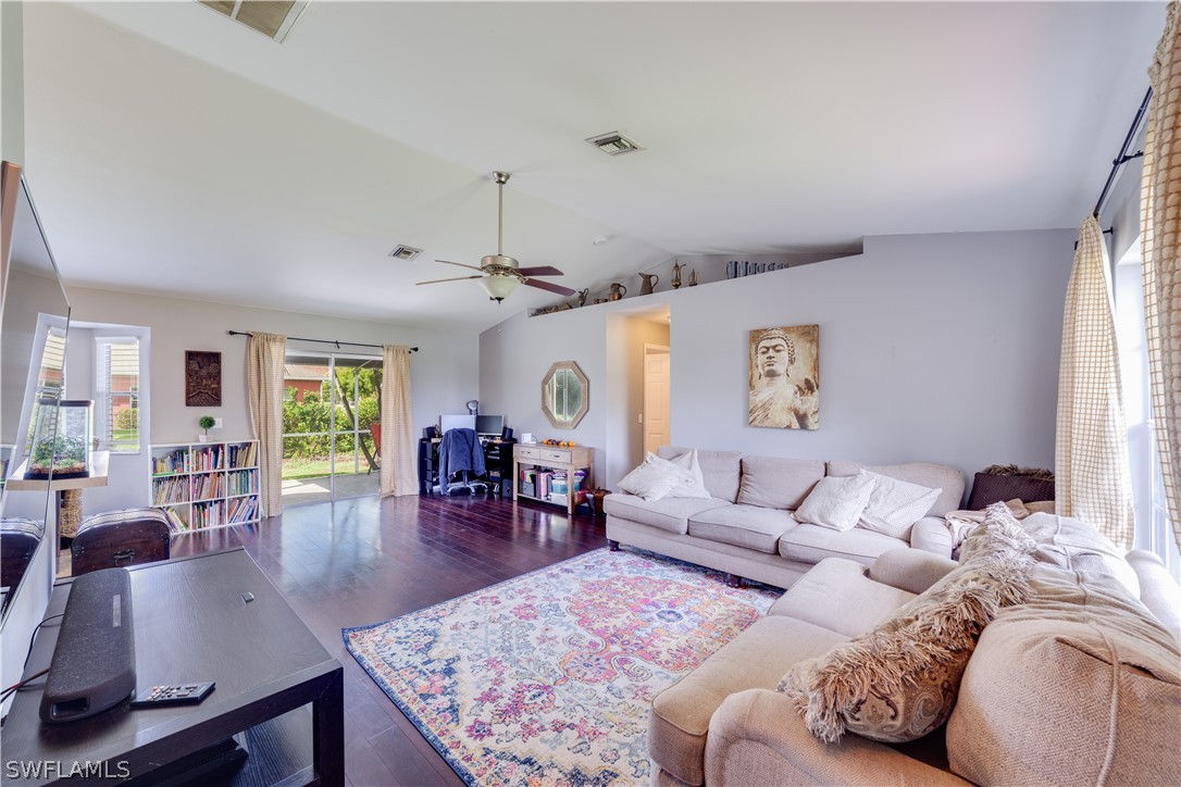 18242 Maple Road Fort Myers, FL 33967 - Photo 6 of 24 a living room with furniture and wooden floor