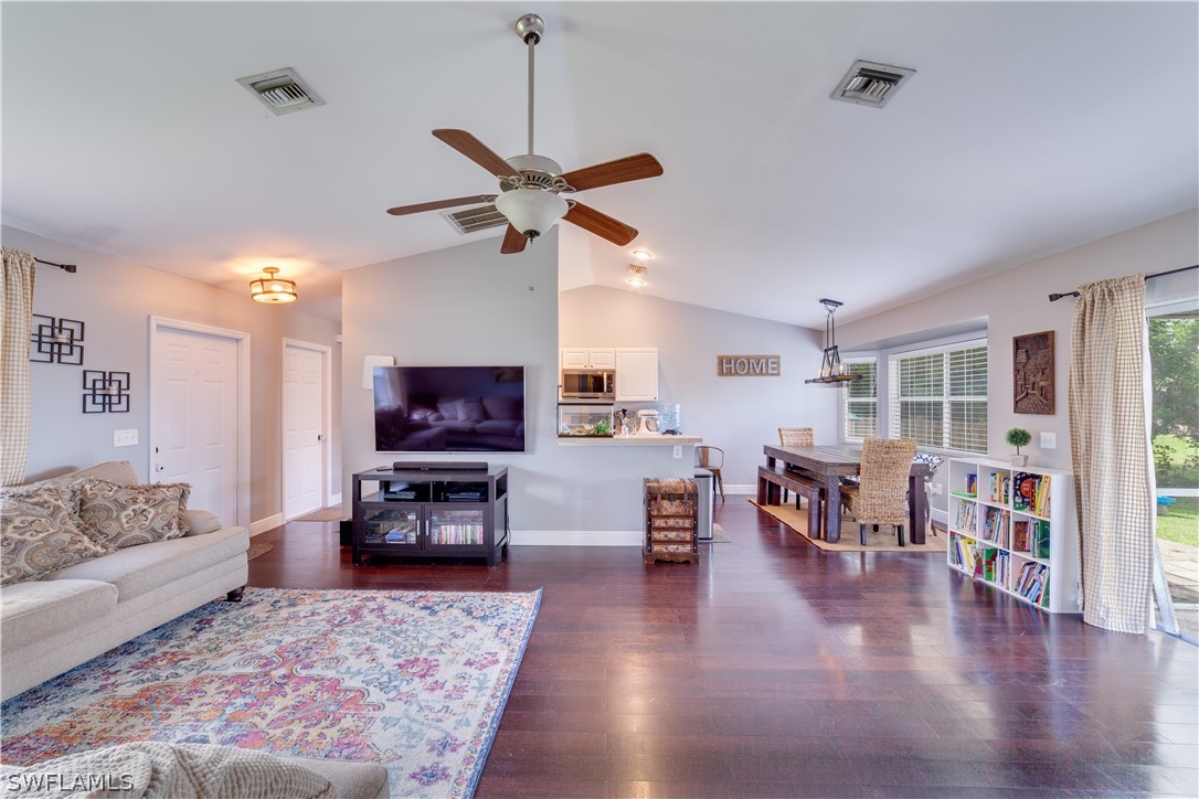 18242 Maple Road Fort Myers, FL 33967 - Photo 9 of 24 a living room with furniture and a flat screen tv