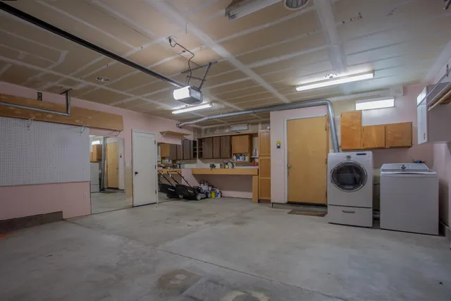 a view of a chairs and table in a backyard