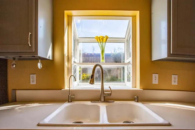 a bathroom with a tub sink and mirror