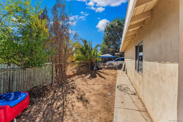 a kitchen with a stove a sink and a cabinets