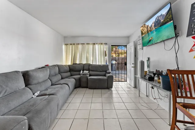 a living room with furniture and a couch