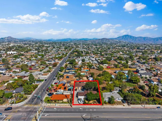 an aerial view of residential houses with outdoor space