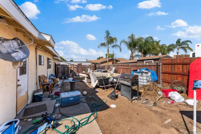 an aerial view of a house with a yard and a fountain