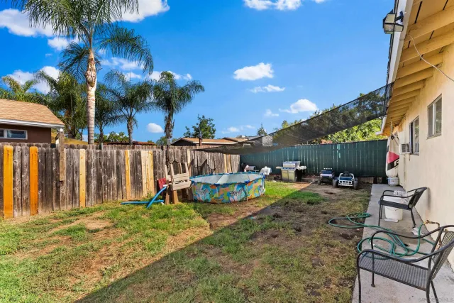 a bedroom with furniture a baby crib and a window