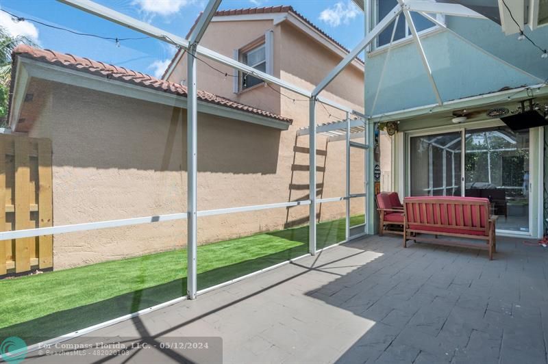 11285 Sunview Way Hollywood, FL 33026 - Photo 22 of 33 a view of a backyard with a small deck and a garden