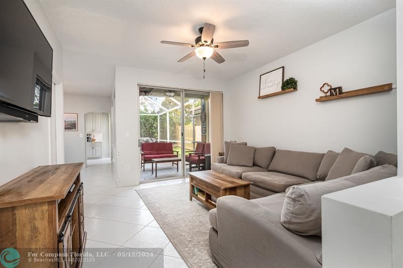 11285 Sunview Way Hollywood, FL 33026 - Photo 4 of 33 a living room with furniture and a flat screen tv