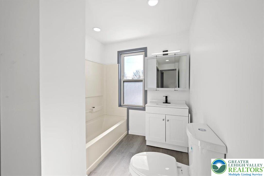 2219 Fuller Street Whitehall, PA 18052 - Photo 20 of 41 a bathroom with a sink a toilet and bathtub