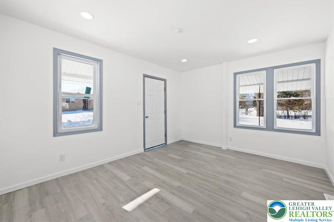 2219 Fuller Street Whitehall, PA 18052 - Photo 8 of 41 a view of an empty room with wooden floor and a window