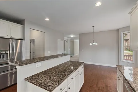 a bathroom with a sink toilet and a mirror