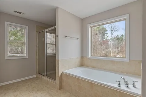 a bathroom with a glass shower door