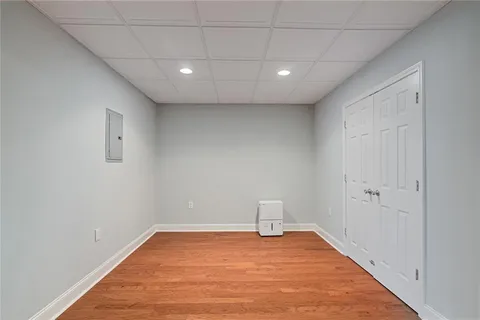 a view of empty room with wooden walls
