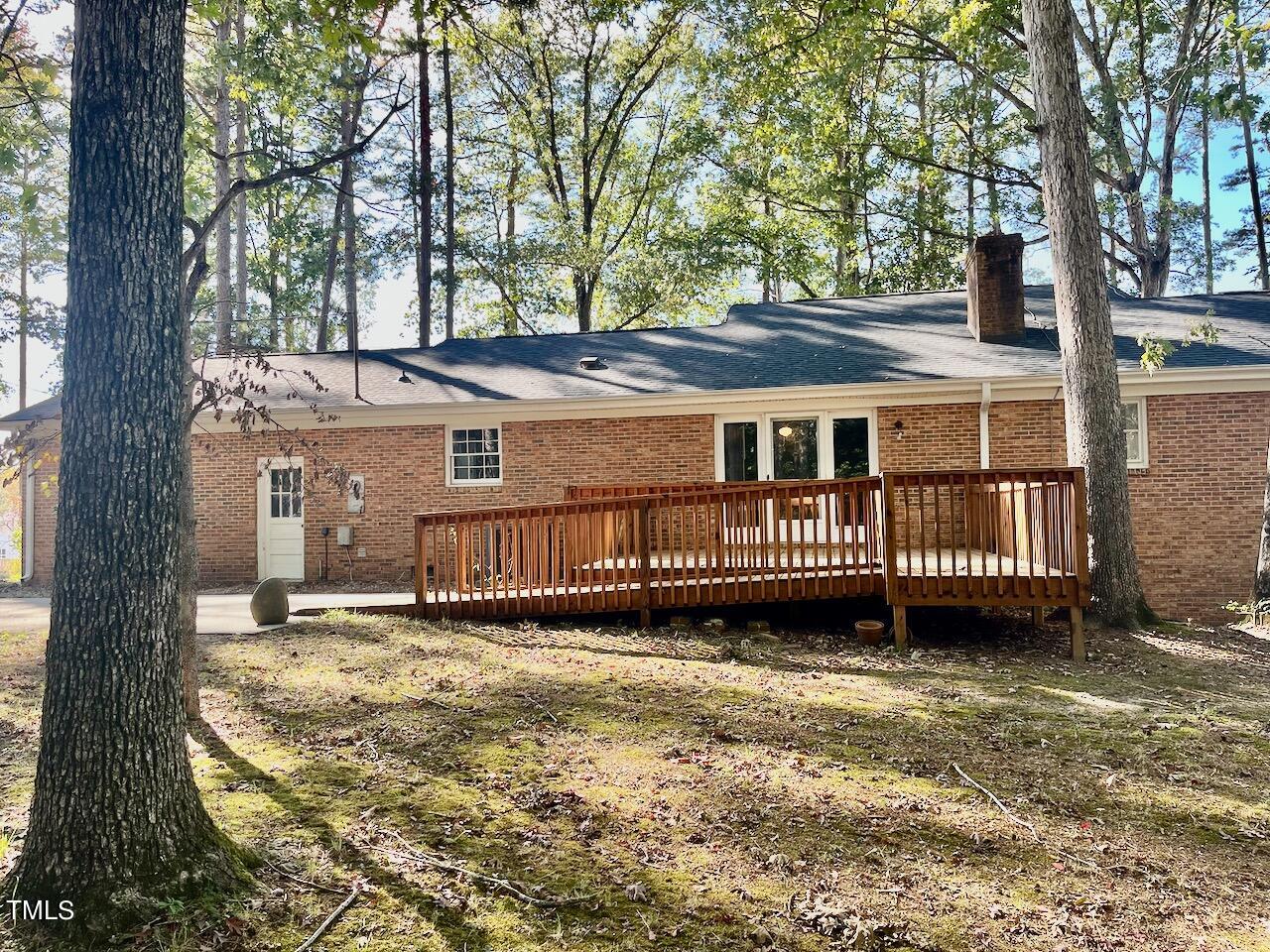 1804 Wall Hill Road Raleigh, NC 27604 - Photo 7 of 24 Note that this deck is wheelchair accessible, and leads to a large patio as well. Notice the personnel door into the garage.
