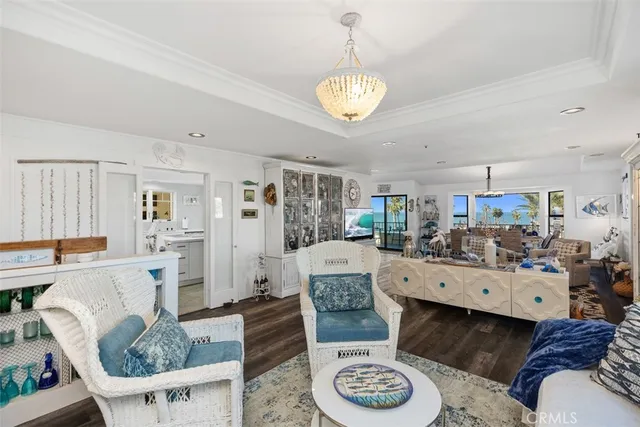 a living room with furniture and a dining table