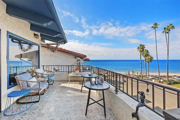a view of a balcony with chairs
