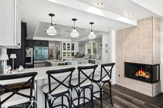 a dining room with furniture and a fireplace